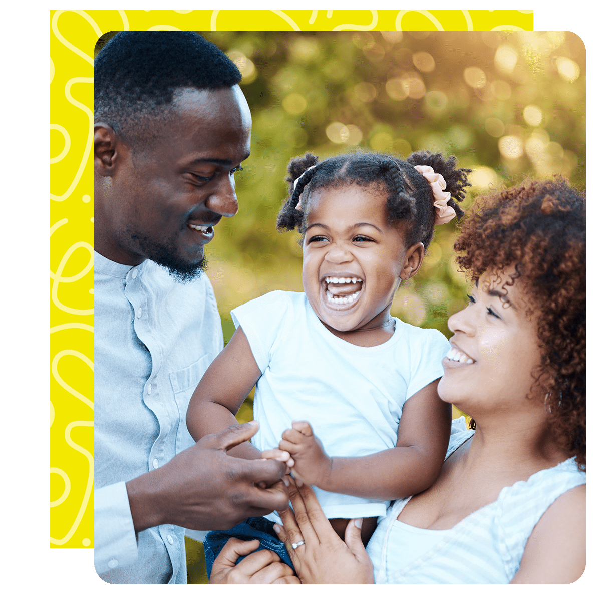 Happy-Family-Yellow-Background happy mother daughter father posing together outside